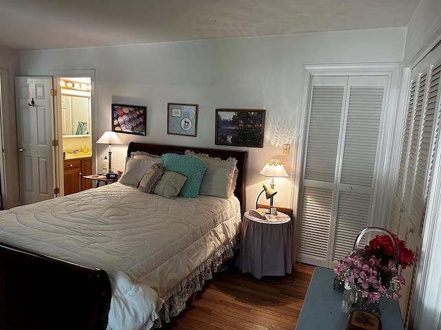 bedroom with dark hardwood / wood-style floors