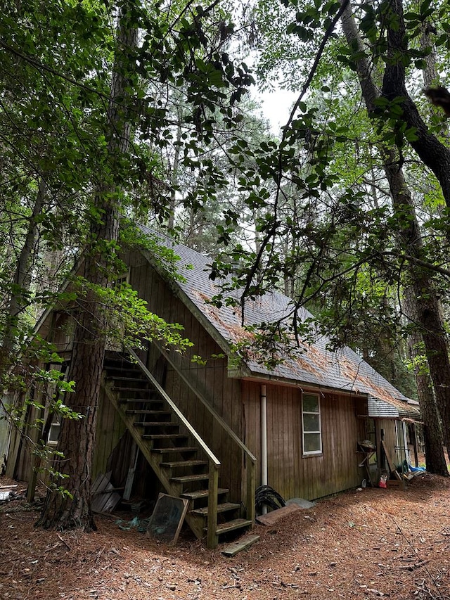 view of side of home with a wooden deck