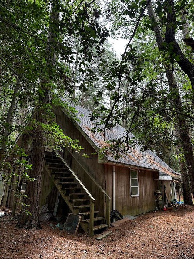 7086 Long Point Rd, Exmore, VA 23350 - back of house with a shingled roof and stairs