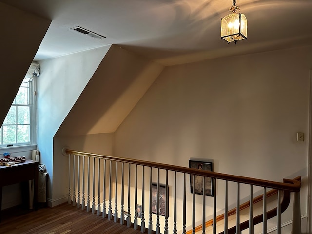 7086 Long Point Rd, Exmore, VA 23350 - stairs featuring wood finished floors, a chandelier, and vaulted ceiling