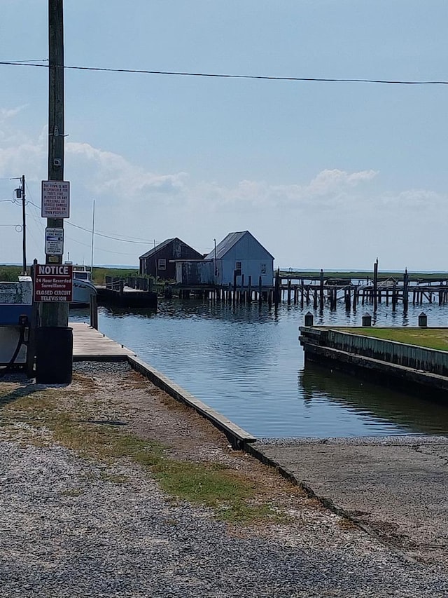 dock area featuring a water view