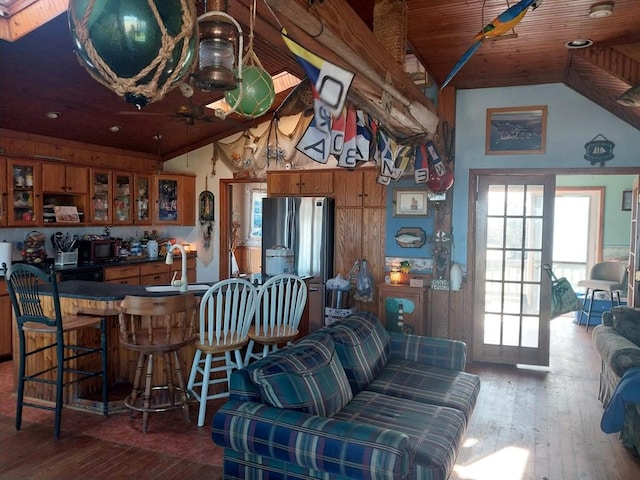 living room with wood ceiling, dark wood-type flooring, lofted ceiling, and wet bar