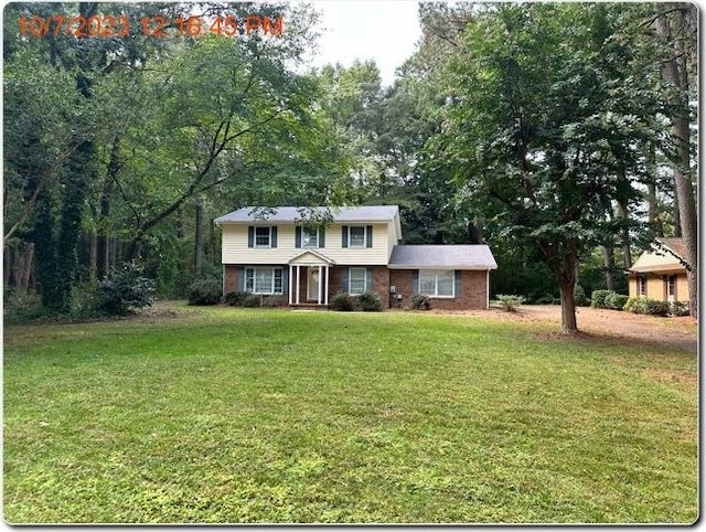 view of front of property with a front lawn