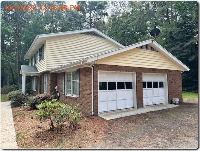 view of property exterior with a garage