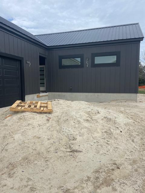 view of exterior entry with a garage