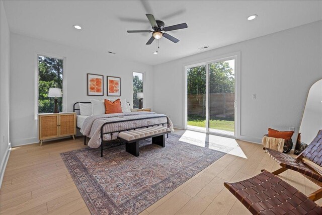 22231 Verlinda Lndg S, Cape Charles, VA 23310 - bedroom featuring access to exterior, multiple windows, light wood finished floors, recessed lighting, and a ceiling fan