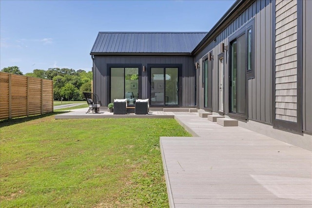22231 Verlinda Lndg S, Cape Charles, VA 23310 - back of house with metal roof, board and batten siding, outdoor lounge area, and a deck