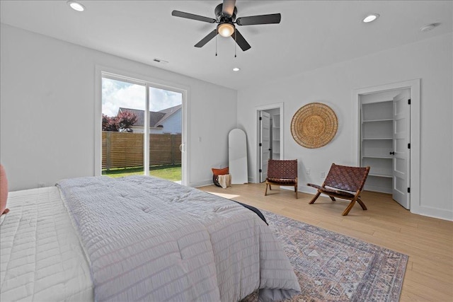 22231 Verlinda Lndg S, Cape Charles, VA 23310 - bedroom with access to exterior, light wood finished floors, recessed lighting, a walk in closet, and a ceiling fan
