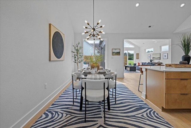 22231 Verlinda Lndg S, Cape Charles, VA 23310 - dining room featuring vaulted ceiling, a chandelier, light wood-style flooring, baseboards, and recessed lighting