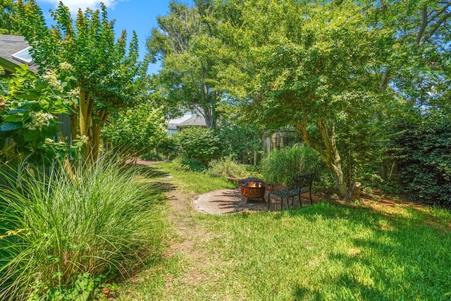 4282 Main St, Chincoteague, VA 23336 - view of green lawn featuring a fire pit