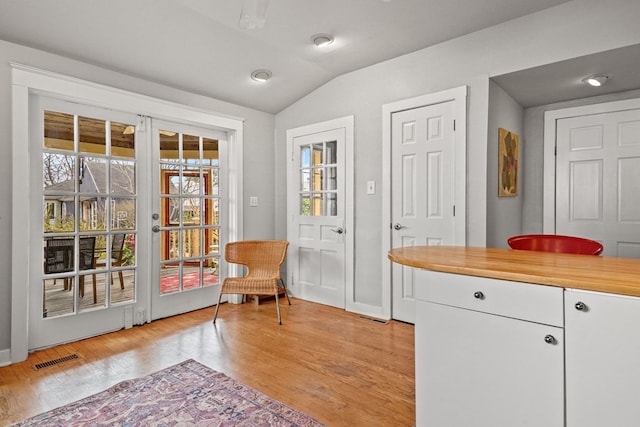 4282 Main St, Chincoteague, VA 23336 - doorway to outside featuring vaulted ceiling and light wood-style flooring