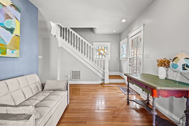 4282 Main St, Chincoteague, VA 23336 - foyer featuring stairway and wood-type flooring