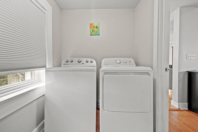 4282 Main St, Chincoteague, VA 23336 - laundry room with independent washer and dryer and light wood finished floors