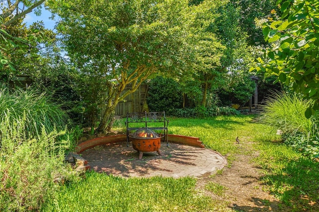 4282 Main St, Chincoteague, VA 23336 - view of grassy yard featuring a fire pit