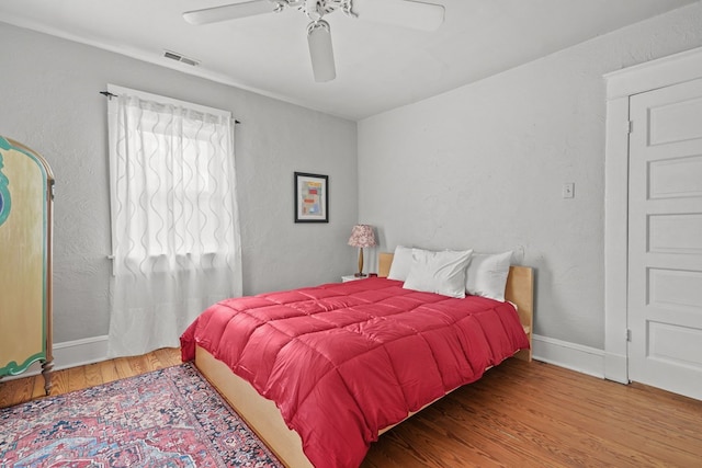 4282 Main St, Chincoteague, VA 23336 - bedroom with wood finished floors and a ceiling fan