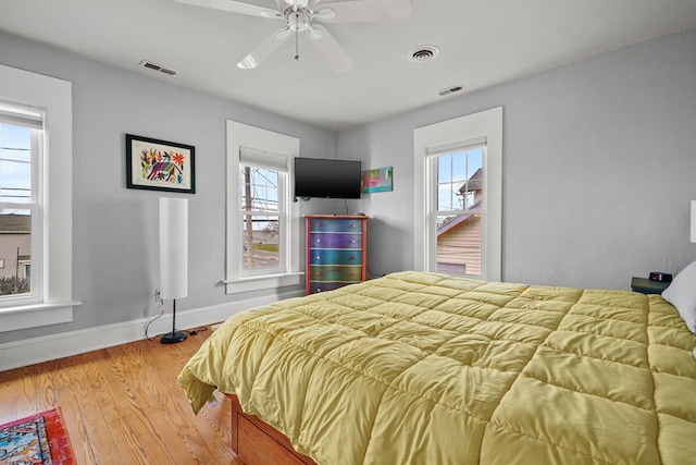 4282 Main St, Chincoteague, VA 23336 - bedroom featuring wood finished floors and a ceiling fan