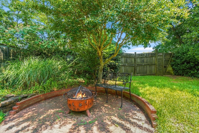 4282 Main St, Chincoteague, VA 23336 - view of patio / terrace with a fire pit
