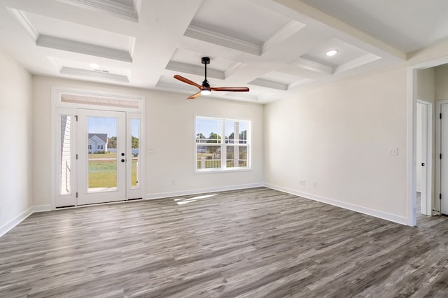 unfurnished living room with wood-type flooring, plenty of natural light, and coffered ceiling