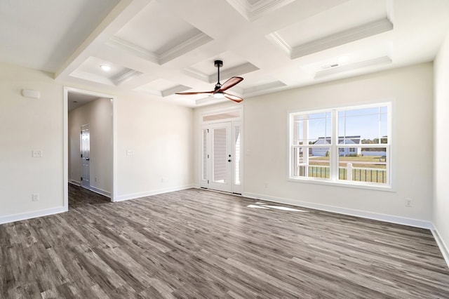 spare room featuring french doors, coffered ceiling, dark hardwood / wood-style floors, ceiling fan, and beam ceiling