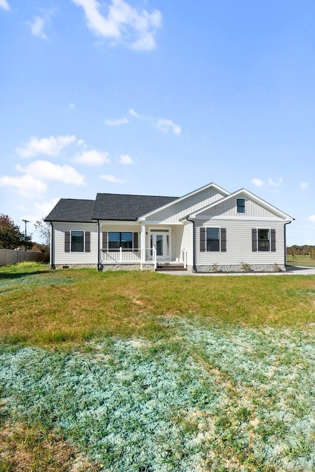 single story home with covered porch and a front yard