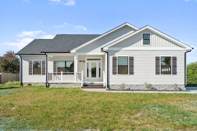 view of front facade with covered porch and a front yard