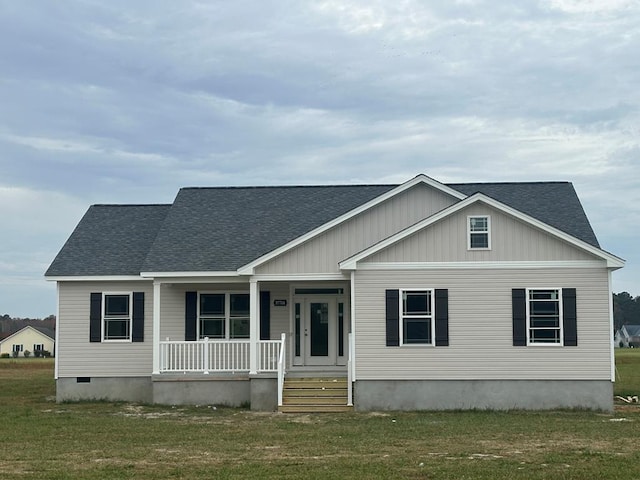 view of front of house featuring covered porch and a front yard