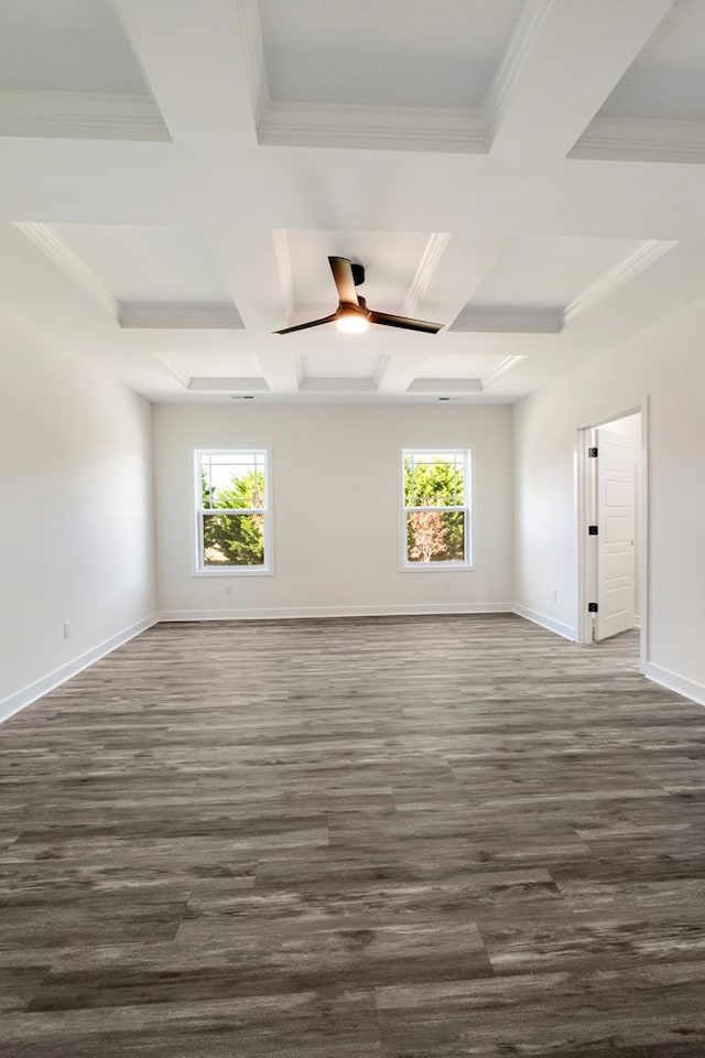 spare room with beamed ceiling, ceiling fan, plenty of natural light, and coffered ceiling