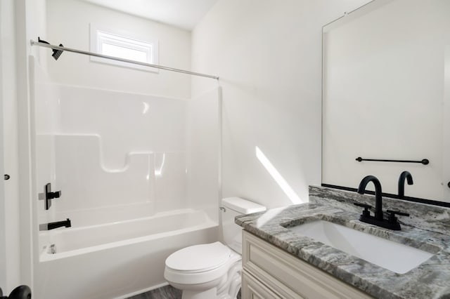 full bathroom with shower / bathing tub combination, vanity, and toilet