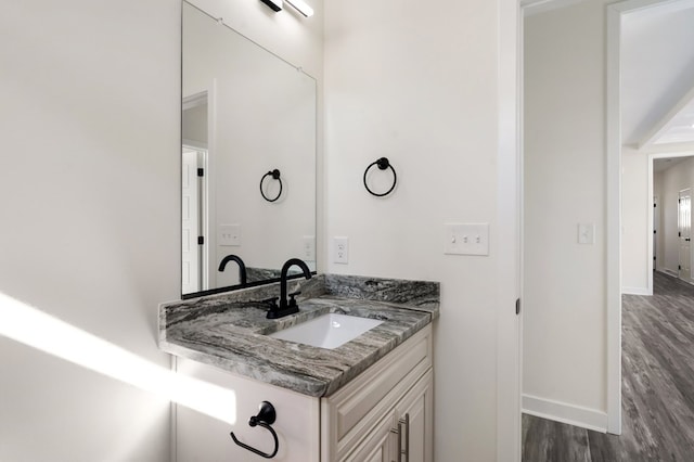 bathroom featuring hardwood / wood-style floors and vanity