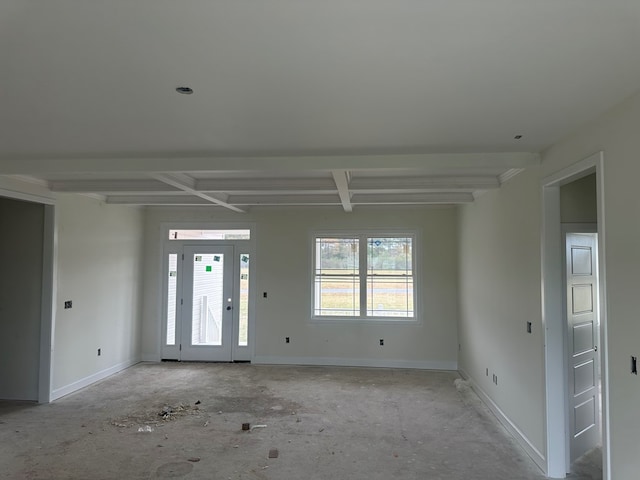 spare room with beamed ceiling and coffered ceiling