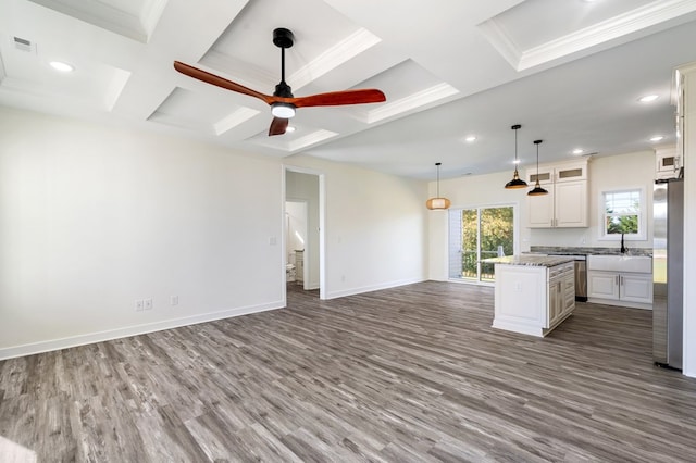 kitchen featuring white cabinets, ceiling fan, a kitchen island, dark hardwood / wood-style flooring, and stainless steel refrigerator