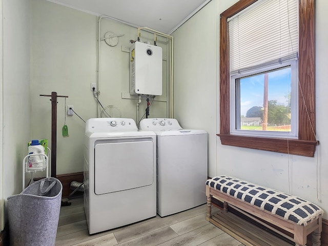 laundry room with washing machine and dryer and water heater