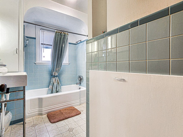 bathroom featuring tile walls, tile patterned flooring, and shower / tub combo