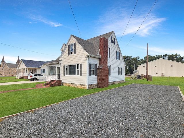 view of front of property with a front lawn