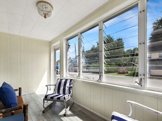 sunroom / solarium featuring a healthy amount of sunlight