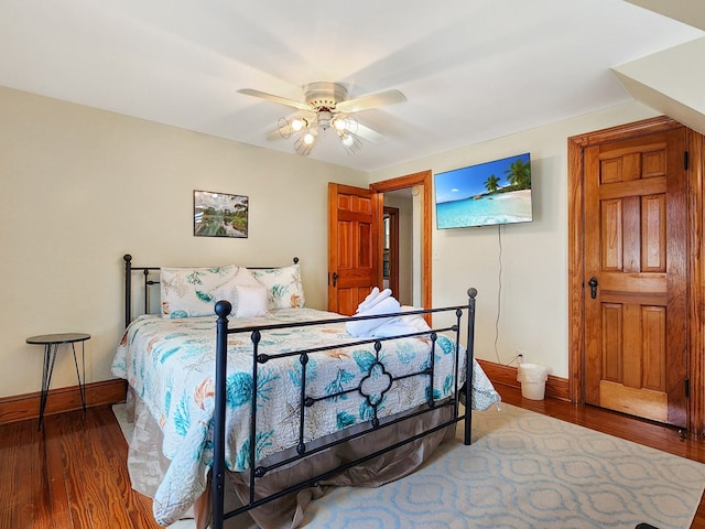 bedroom featuring hardwood / wood-style floors and ceiling fan