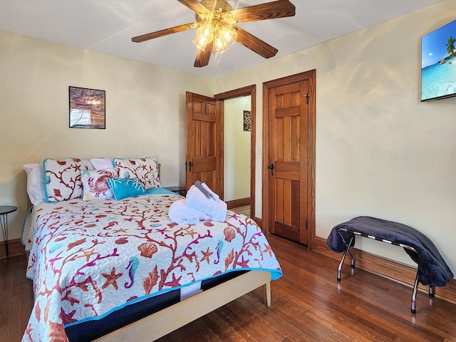 bedroom featuring ceiling fan and dark wood-type flooring