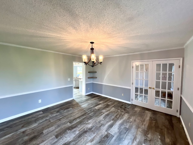 unfurnished dining area with french doors, a textured ceiling, crown molding, a notable chandelier, and dark hardwood / wood-style floors