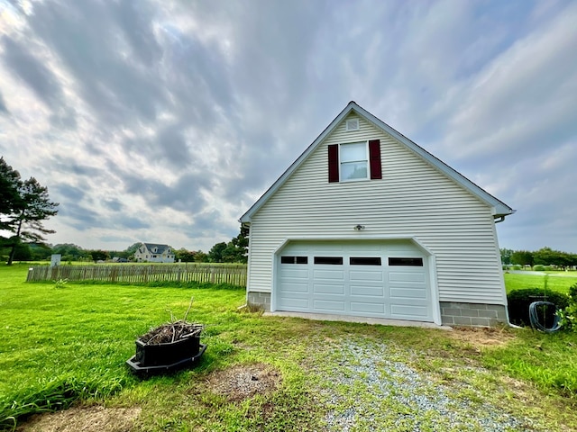 view of home's exterior featuring a yard and a garage