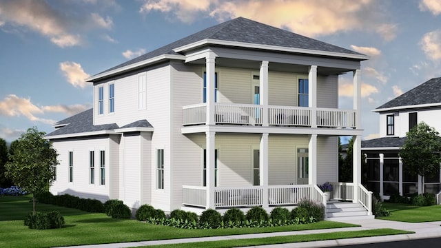 view of front of house featuring a porch, a balcony, and a yard