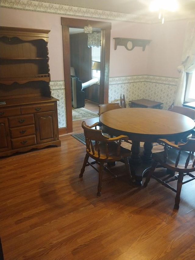 dining area with a chandelier and wood-type flooring