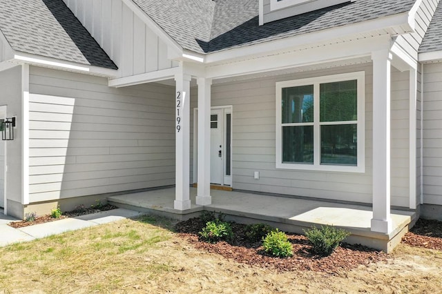 22199 Verlinda Lndg S, Cape Charles, VA 23310 - doorway to property featuring covered porch, roof with shingles, and board and batten siding