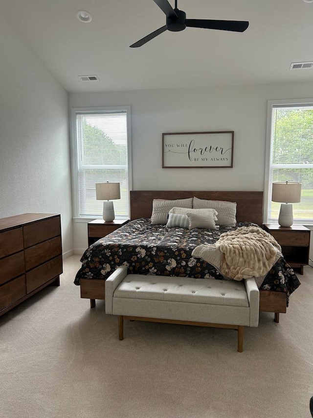 22199 Verlinda Lndg S, Cape Charles, VA 23310 - bedroom featuring light colored carpet, multiple windows, and ceiling fan