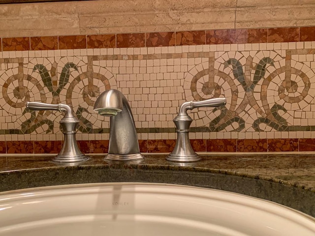 details featuring decorative backsplash and a sink