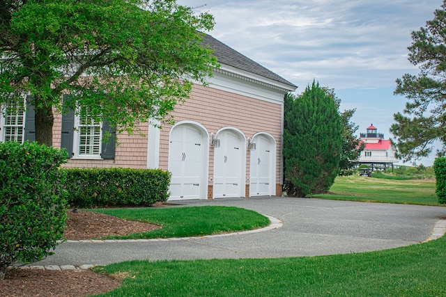 garage with a yard