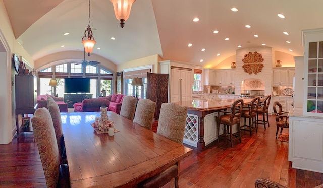 dining area featuring dark wood finished floors, recessed lighting, and lofted ceiling