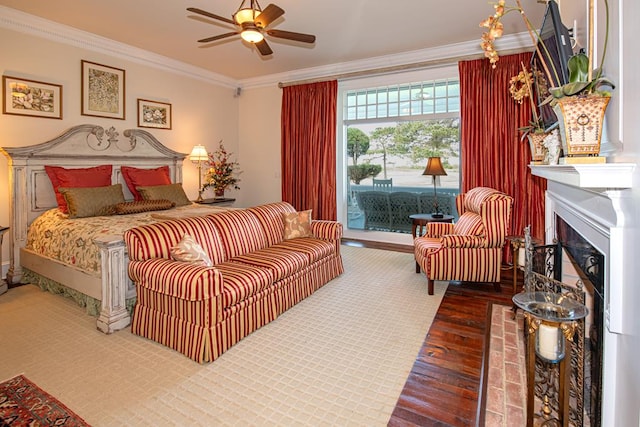 bedroom with access to outside, ceiling fan, hardwood / wood-style floors, and ornamental molding