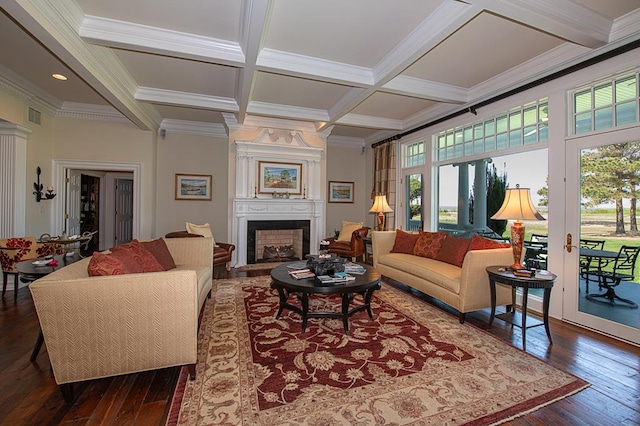 living room with dark wood-style floors, a healthy amount of sunlight, coffered ceiling, and a large fireplace