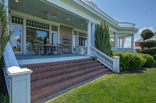 doorway to property featuring a porch and ceiling fan