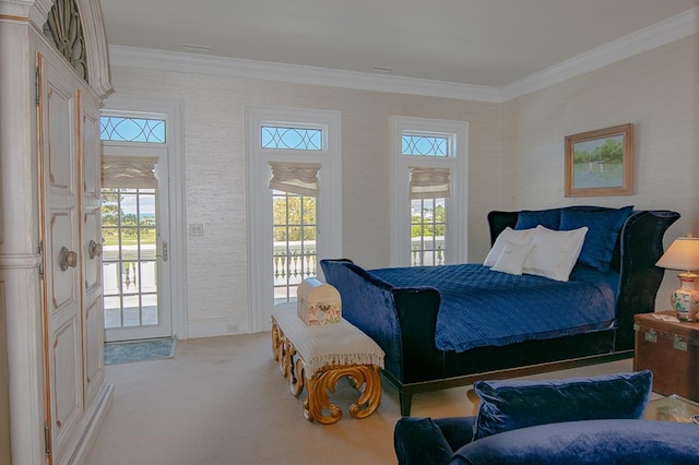 carpeted bedroom featuring crown molding and access to outside